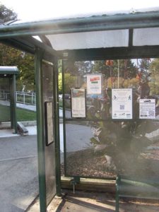 Permanent Street Story sign at a bus stop