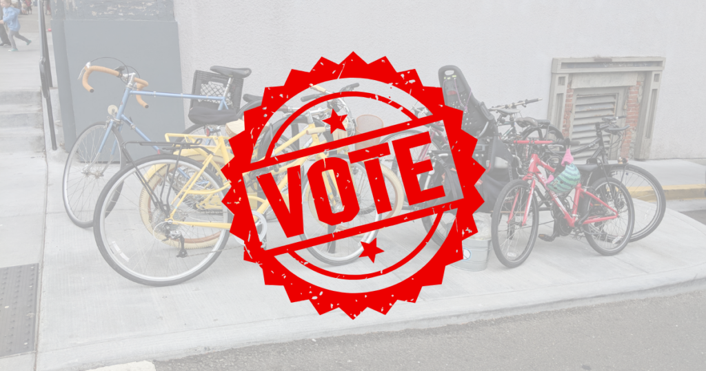 A stamp saying "VOTE" with a background photo of bicycles